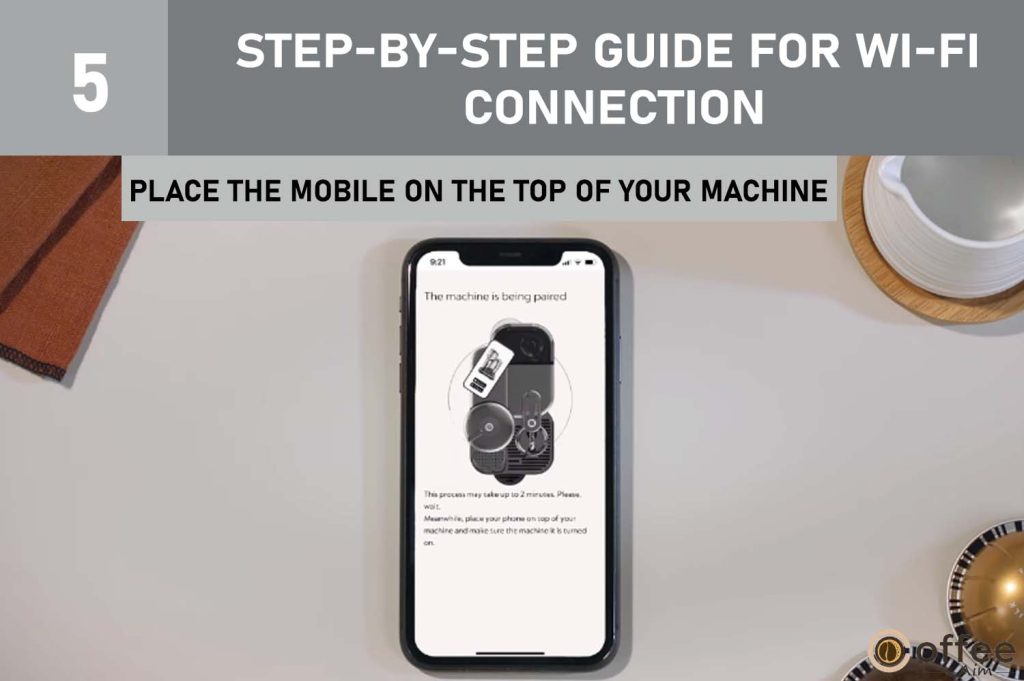 This image provides instructions on "Placing the Mobile on Top of Your Machine" as part of the process to "Keep the Mobile Device Close to Your Machine" in the article "How to Connect Nespresso Vertuo Creatista to Wi-Fi and Bluetooth?"